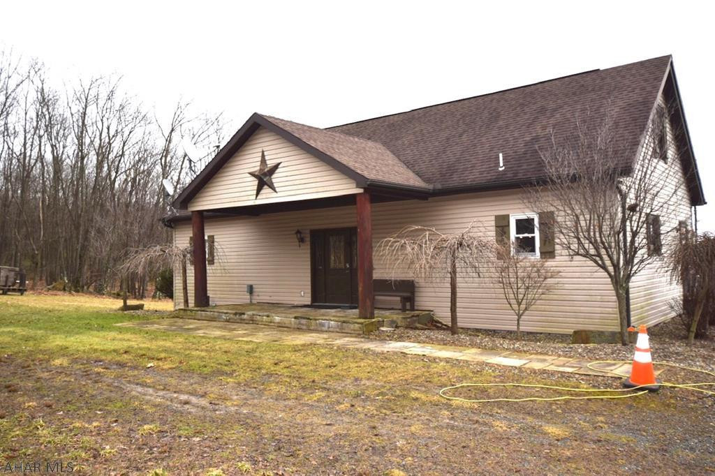 Beautiful rustic home set on over nine acres.  Great room with vaulted ceiling and fireplace.  Kitchen with large center island and spacious dining area.  Two rear decks.  One off master bedroom and one off kitchen.    Fabulous views.  A perfect retreat waiting for you.