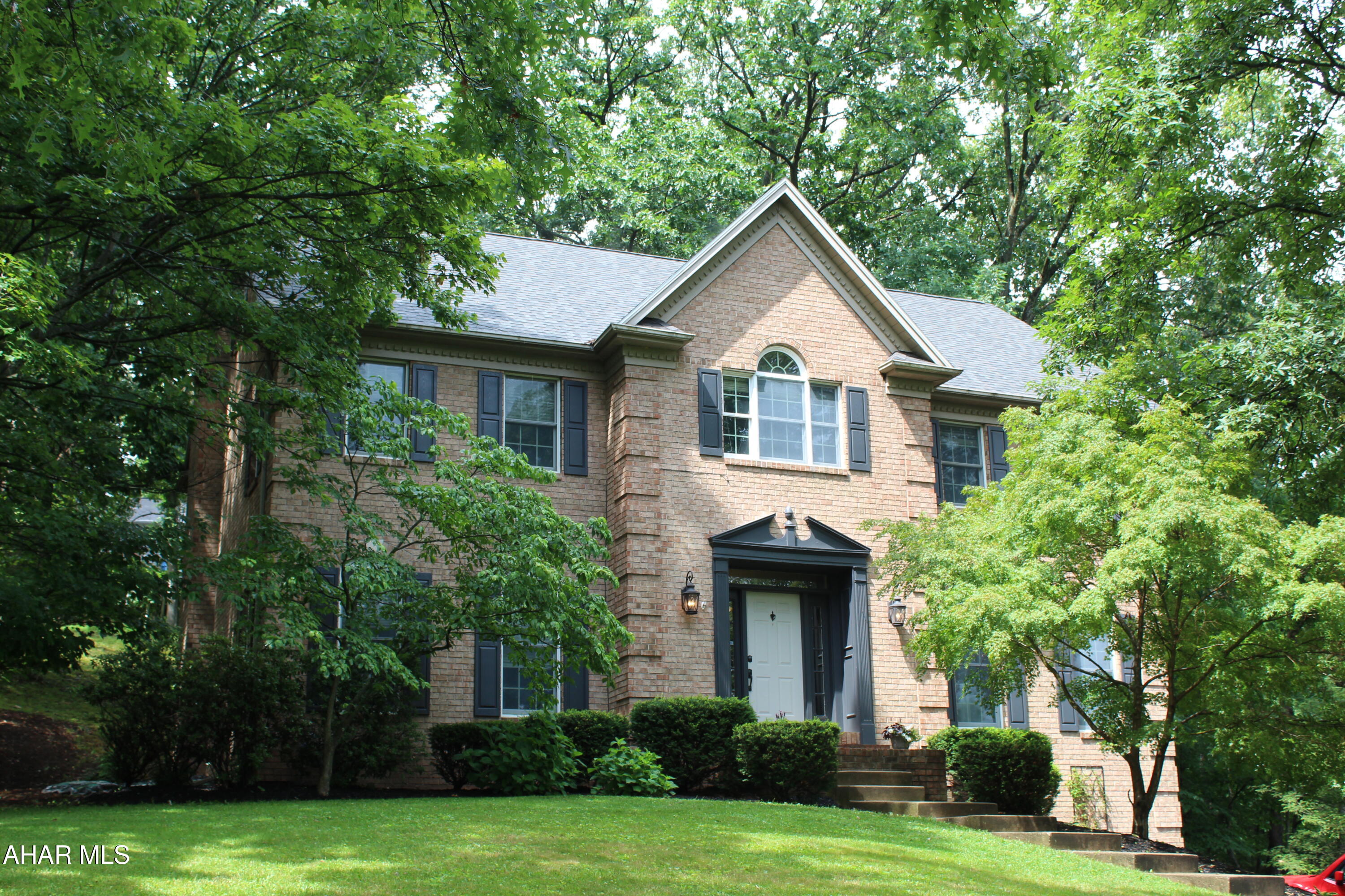 Welcome home to Hickory Hill! This beautiful home offers the perfect blend of quality craftsmanship, comfort, and privacy. The spacious kitchen features granite countertops, oak cabinetry with a rich cherry finish, and custom ceramic tile flooring. Enjoy entertaining in the formal dining room with stunning solid cherry hardwood floors. The oversized primary suite includes a walk-in closet and a luxurious en-suite bath with a custom ceramic tile Jacuzzi tub and separate shower. Need extra space? The large finished attic with heat and central air is perfect as an additional bedroom, playroom, game room, home office, or abundant storage. Step outside to a peaceful, wooded backyard and relax on the Trex deck while enjoying the privacy. With a newer roof and so much versatile living space, this Hickory Hill gem is ready to welcome you home!