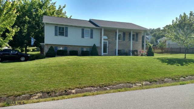 Spacious 3 bedroom, 2.5 bathroom home on a nicely landscaped, corner lot, in Rolling Hills. The large, eat-in kitchen has beautiful oak cabinets and is very bright and cheerful.  The living room and dining room are also very large.  The tiered deck off the dining room and the mature landscaping add great curb appeal to the property.  Features include a new furnace in 2015, new roof in 2012, updated bathrooms in 2014-2015, newer hot-water heater and well tank, a 2 car garage, and a shed.  Additional updates are listed on the mls.  Super home with super neighbors.