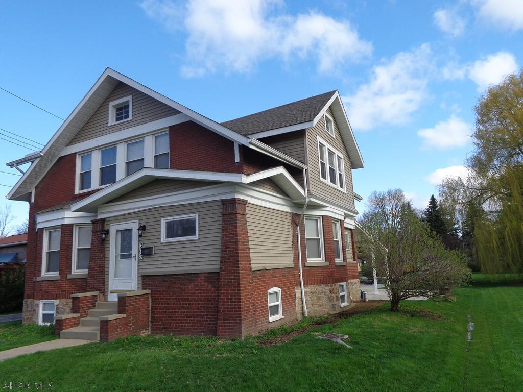 A Classic 4 B/R Brick Beauty!  Along with the original woodwork, beautiful hardwood floors, stained glass windows, built in china cabinet, french & pocket doors, fireplace & a heated 2 car garage all complete this gorgeous home.  Seller is working on getting the house out of the flood zone.  It will be taken out of the flood zone once FEMA processes the paperwork on July 24, 2018.  There is a half bath in the heated garage.