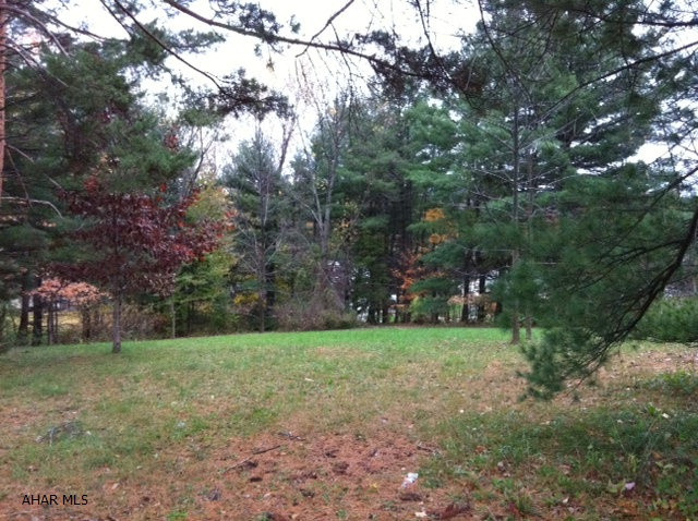 Large Corner Lot in desirable area at end of street of small group of homes. Private area. Utilities at street. Water would be brought up from 58th Street or Oak, or well.  Sewer is at street.