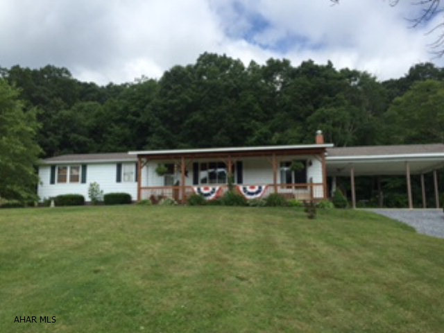 Ranch home on 4.051 acres. Pretty views, large yard, woods, carport, and detached garage. Home has 3 bedrooms, main floor laundry, partially finished basement. Basement has a great family room area, second kitchen, and plumbed for another bathroom. Very nice location and close to everything.
