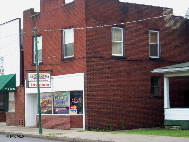 3 rental units; 1st floor commercial space renting for $550.00 pr/month (2 years remaining on lease)1st floor rear; 2 BR, 1 Bath, LVRM, kitchen (tenant pays utilities rent $330.00 pr/month.2nd floor; 2 BR, 1 Bath, LVRM, kitchen, (tenant pays utilities Rent $330.00 pr/month.