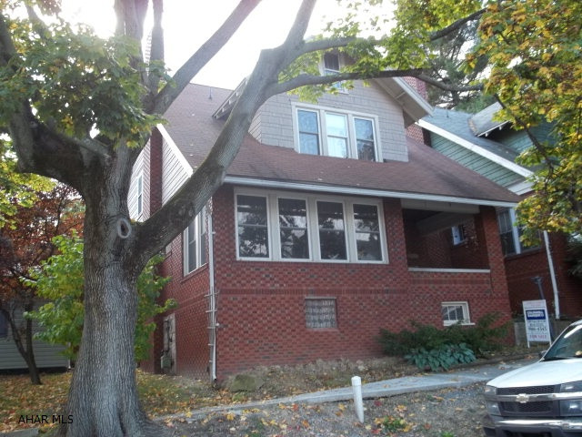 Great Brick home with large kitchen and new stainless appliances, off street parking, four bedrooms, great bones, large rooms with original woodwork and hardwood floors
