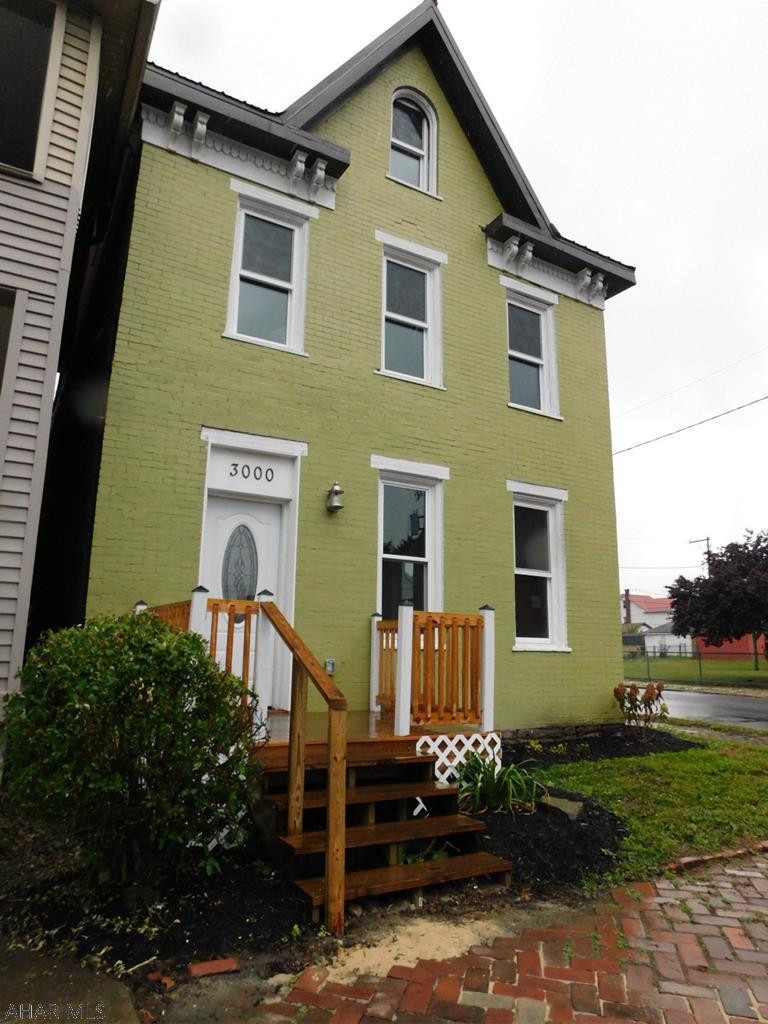 This Brick home was completely redone from the roof down.  All new windows, electric, plumbing, heating, insulation and more.  It was gutted to the studs and rebuilt.  All permits pulled and fully inspected.  A move in ready just drop your bags home!  Situated on a corner lot & Back fence can easily be pulled in for off street parking.  1st floor laundry and spacious first floor are to die for.  The master bedroom features a walk in closet and half bathroom.  Electric heat on 2nd and 3rd floor - gas forced air on 1st floor.