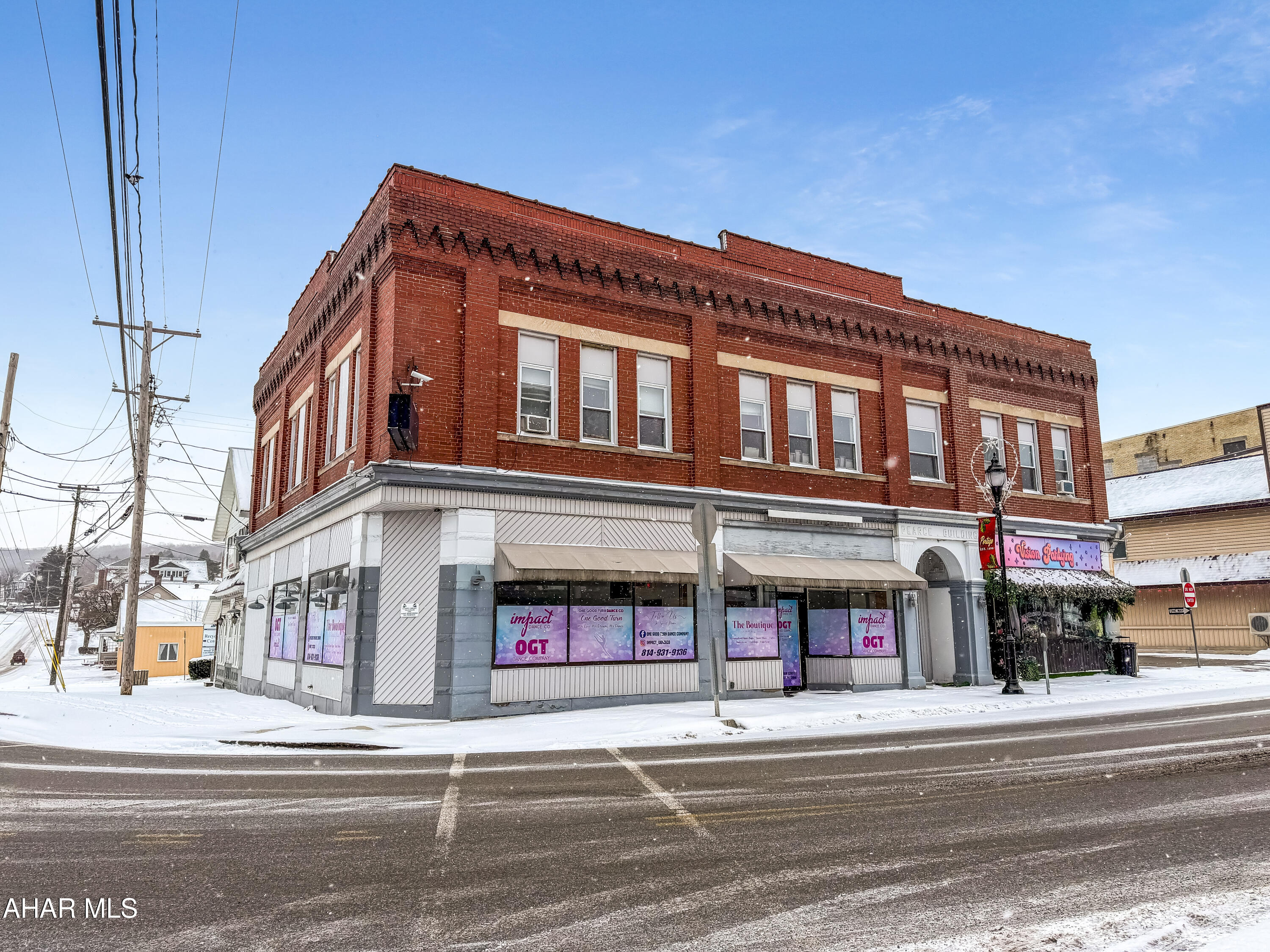 Incredible opportunity to own a well-maintained, commercial property in the heart of Portage w/ deep history, ideally positioned on a corner at one of the town's busiest & most visible locations. This stately all-brick building offers approximately 6,800 square feet of finished space plus an additional 3,400 square feet of basement, providing ample room for a variety of uses. The main level is currently occupied by strong tenants operating a dance studio & an art studio, while the expansive upper level offers outstanding potential for offices, apartments, or other income-producing use for the future. With its rich history, prime location, & versatile layout, this property presents endless possibilities as a solid investment, owner-occupied opportunity, or future redevelopment. There are 2 parking spots owned with this property and additional parking can be found in the free borough owned lot at the rear. Call today for more details!