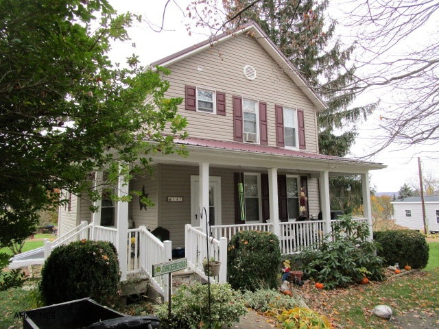 This nicely updated two-story home features a new metal roof, new vinyl siding & thermo pane windows. First level has a LR, Kit w/breakfast bar, dining area, first level laundry & mud room. 3-Beds and 1-Bath on second level. Large rear deck, front covered porch, level-flat yard & storage shed. Oil FA heat, wood stove & pellet stove. Move-in ready!