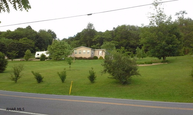 Well maintained doublewide on just over an acre in Bedford! This home has a nice open floor plan with a master bath and double closets. This rural setting is great for added privacy. This home also features a 14x30 workshop out back that has electric ran to it. The title to the home has been retired  and does qualify for FHA financing depending on lender. Call listing agent today for your showing!