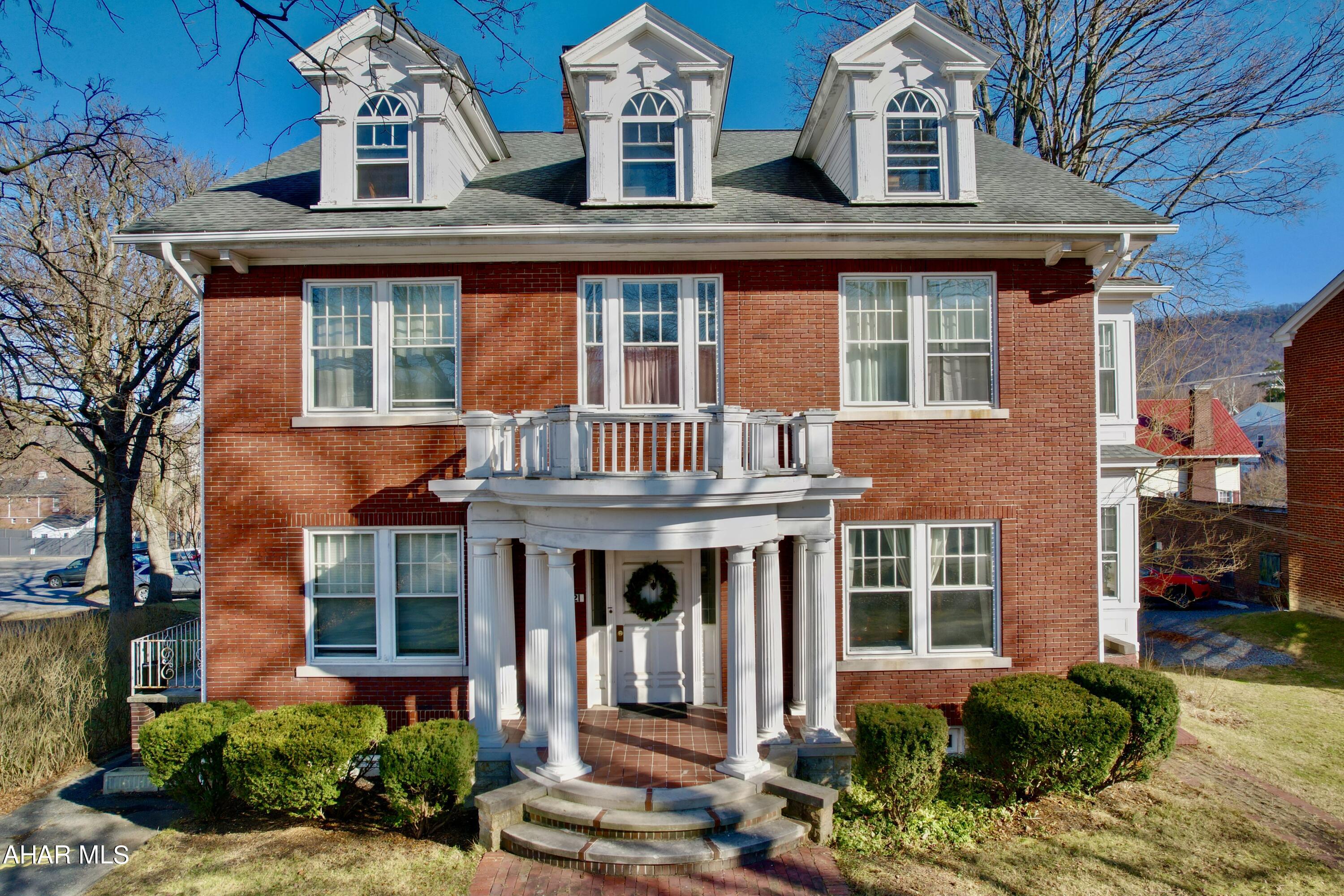 Beautiful brick colonial home in downtown Bedford.  This elegant home boasts high ceilings, ornate architecture, original glass French doors, transom windows, stained glass windows, grand fireplaces, foyer, tile work, stonework, large kitchen and more.  Site back and enjoy the architecture of the roaring 1920's.  The large lot with perennial gardens, garden pond, carriage house, and patio bring beauty and serenity to the back yard.  Restore this home to a single family residence or continue as a multi-unit home.  Have the best with both options, live in this elegant home and rent out the 3 additional units.  Comes with a large garage with additional off street parking.  In historic downtown Bedford, minutes away from Historic Bedford Springs, Shawnee State Park, Blue Knob State Park, Rocky Gap State Park and Casino.  Close to I99, Pa turnpike, I70, I68. 2 hours away from Washington DC, Pittsburgh and Baltimore.