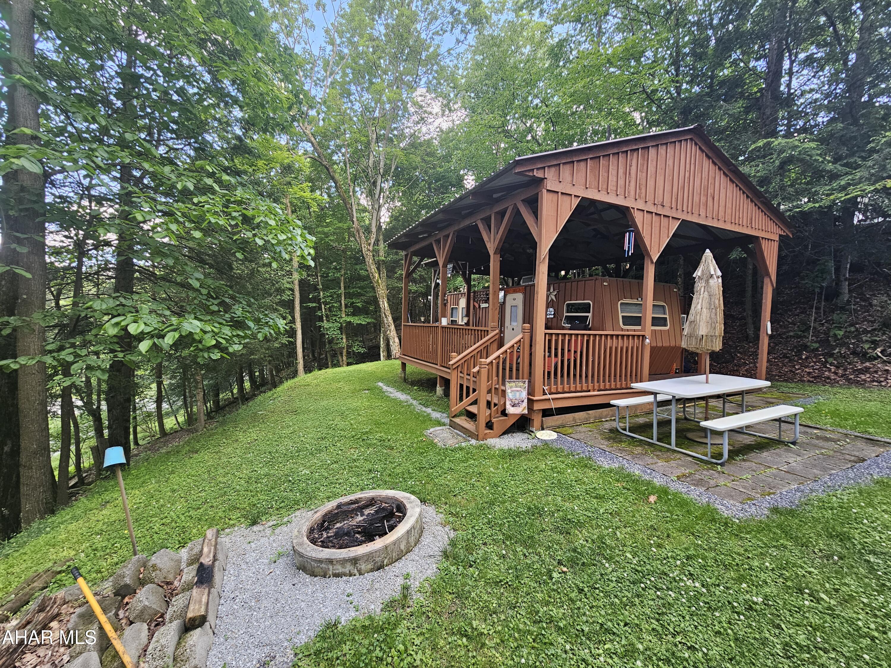 2000 camper with 1 bed and 1 bath on 1 lot inside Glendale Yearound. Deck and pavilion over camper. Glendale Yearound is a gated community located minutes from Glendale Lake and Prince Gallitzin State Park. Community pool, tennis court, basketball, security, and more.