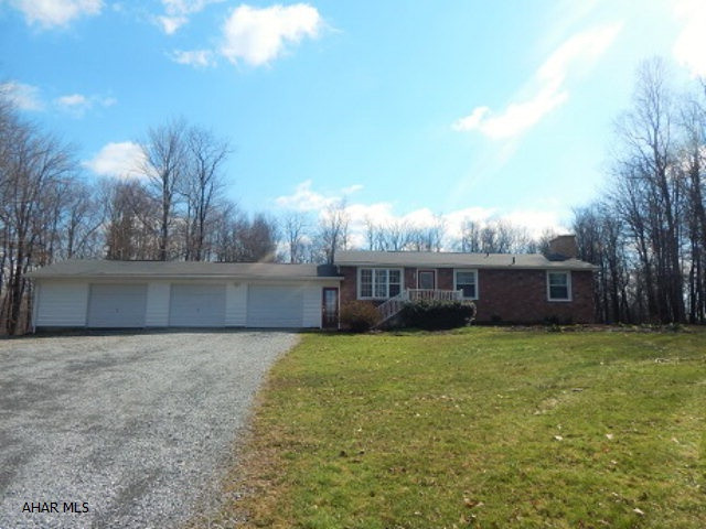Private! Wildlife! On 4.8 acres! 1 story modular with 3 BRs, 1 3/4 baths, Full finished basement with Huge Family room with fireplace. 3 car garage.