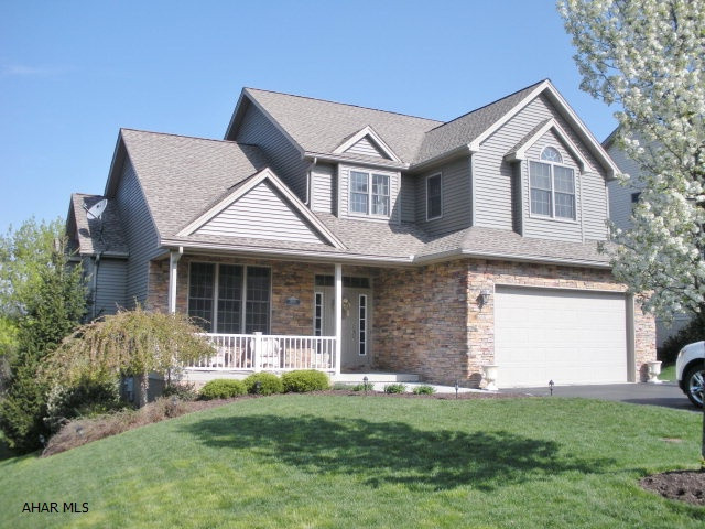 Beautiful stone & vinyl custom home in Edgewood Estates. 3-4 bedrooms, 2.5 baths, oak kitchen with island, 1st floor laundry, 9 & 10 ft. ceilings, master suite with trey ceiling, 2 family rooms, hardwood floors, solid oak doors & trim, large storage room, central air & more!