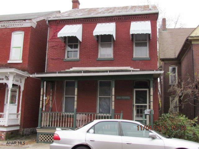 brick exterior, covered parking area, fenced in yard, kitchen needs finished