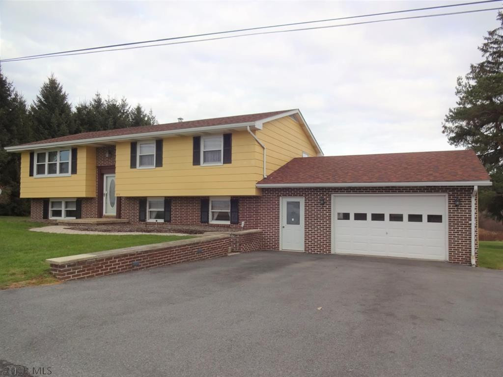 This home is situated  in a lovely country setting. Full finished basement with a Great Room & a family Room. Pellet stove insert in FR fireplace. Newer roof & windows. Nicely maintained.