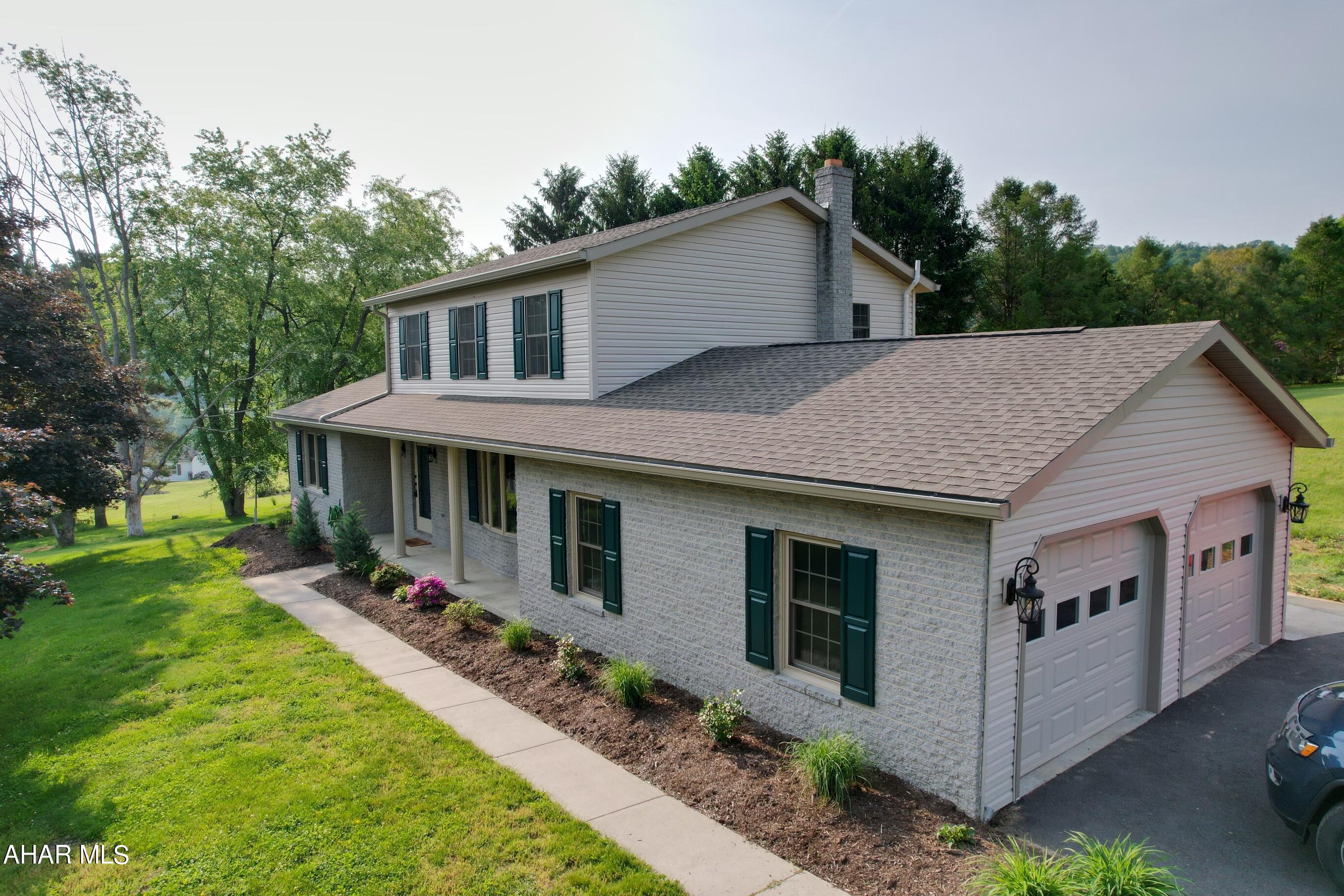 Enjoy the sounds of nature in this lovely colonial style home located on quiet cul de Sac within minutes of Omni Bedford Springs and historic downtown Bedford. The home has a been beautifully updated which includes all new siding, new roof, new windows, new sliding glass doors, new decking, new garage doors, new driveway, new professional landscaping, new bathrooms, new flooring and  new interior painting.  Its a place you will love to come home to while enjoying wonderful sunsets and the beauty of living in the Alleghany mountains.  Simply a wonderfully maintained home just waiting to be loved like the current owners.