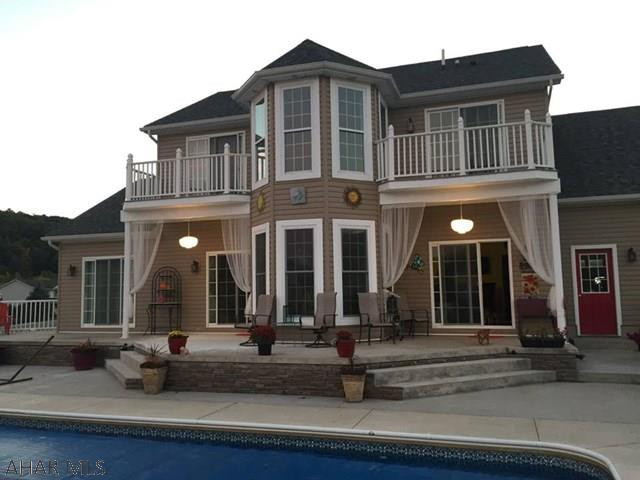 MOTIVATED SELLERS! Intriguing & impressive home that boasts quality throughout from the two-story foyer to the extensive outdoor living area. Built for entertaining! The foyer flows naturally to the Great Room, dining, & kitchen- all areas offering intimate yet luxurious gatherings. You'll appreciate the attention to detail from the 2-story wall of windows, fireplaces, granite, & marble throughout the 3 full floors of living space. 1st floor Master suite is sure to please w/ a Jacuzzi tub, fireplace & walk out to the hot tub!  Half bath & mud room/laundry room complete the 1st floor. 3 BR, office, bonus room w/ bar & full bath on the 2nd floor, all rooms offering mountain views. Impressive 32'x16' heated pool, outdoor kitchen, hot tub, stamped concrete, decking, professionally landscaped.