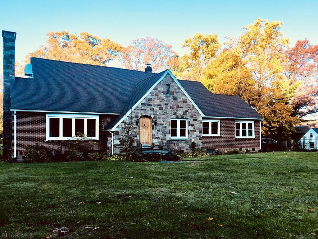 Large 2 story brick home with over 3000 square feet. This beautiful home has a new modern kitchen, 2 large bathrooms, 4 bedrooms, sun room, office with built ins and large living room with fireplace. Geothermal heat and A/C. 2 car garage and large fenced in yard. Logan township.