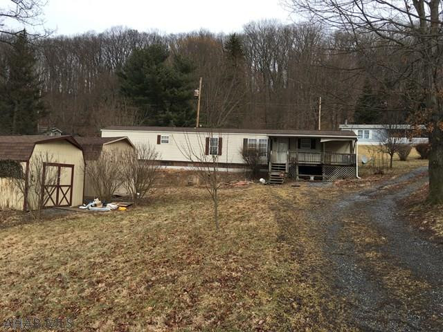 1991 12x70 singlewide trailer on double lot 125x150.  Needs TLC.  2 sheds for storage. The water is a shared well and will need to tap onto the city water and city sewer at buyers expense.  Costs to tap on for city water and city sewer is $1484.00.   Contact Bedford Twp. for more details.
