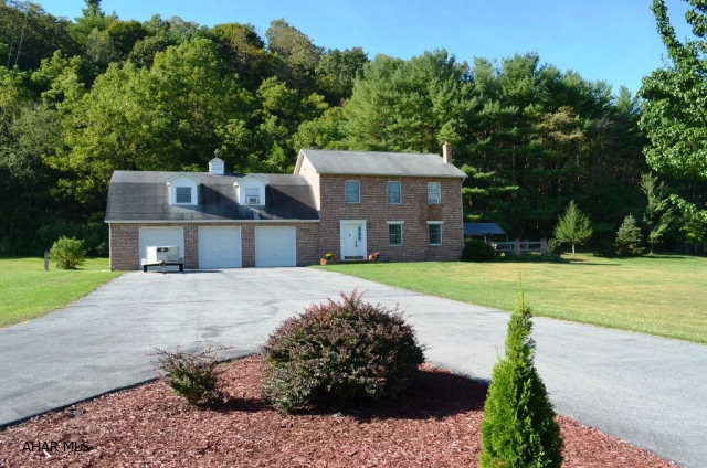 Lovely location in the Imlertown area.  2 Story Brick Colonial on 9 ac.  Large kitchen with Oak Cabinets.  Cement patio off of the dining room that overlooks the Retrieving Pond.  Land goes to the top of the ridge in the back. Family room above the 3 car garage. The location is so peaceful.