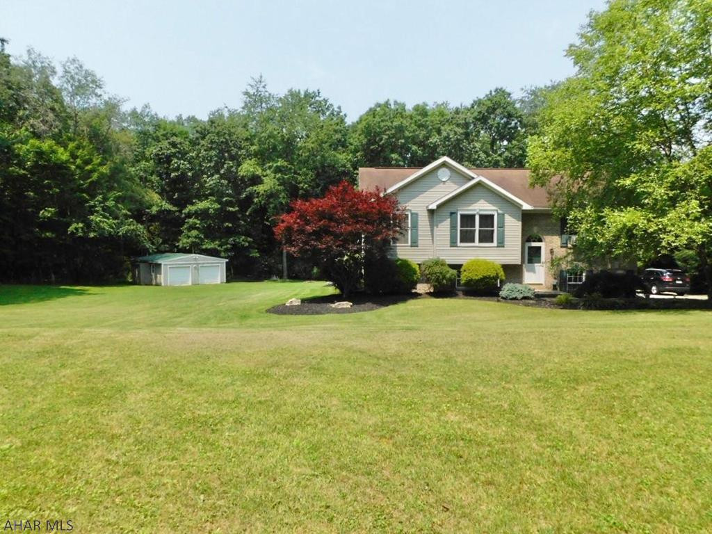 Your private oasis is here!  Fall in love with this gorgeous bi-level home with over 2600 square feet, situated on 1.48 acres in the Tyrone School district. Entertain with family and friends throughout your open concept main floor. The walkout back deck will top the party off, with views to die for. The lower level is newly finished to offer extra gathering space. With 4 bedrooms & 2 bathrooms, the home is perfect.  Don't forget the 2 car detached garage for all of your projects. Contact the Listing Agent today for your private tour.