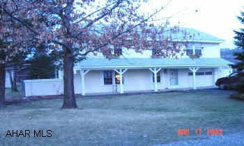 New oak kitchen, vinyl windows, large lot, low utilities (electric $80/mo., gas $32/mo.).  Large level lot with periennial flowers and mature trees.  Home Warranty included.