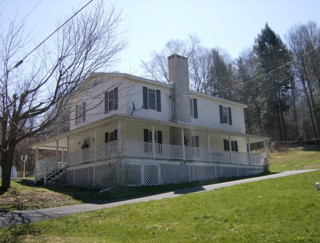 Beautiful property on 5+ acres.  Newer kitchen. 1st floor 3/4 bath and laundry. 2 large bedrooms (possible 3) & bath on 2nd floor.  Vinyl tilt thermo windows Amazing wrap around porch & Patio. Circular driveway. Exceptional setting!