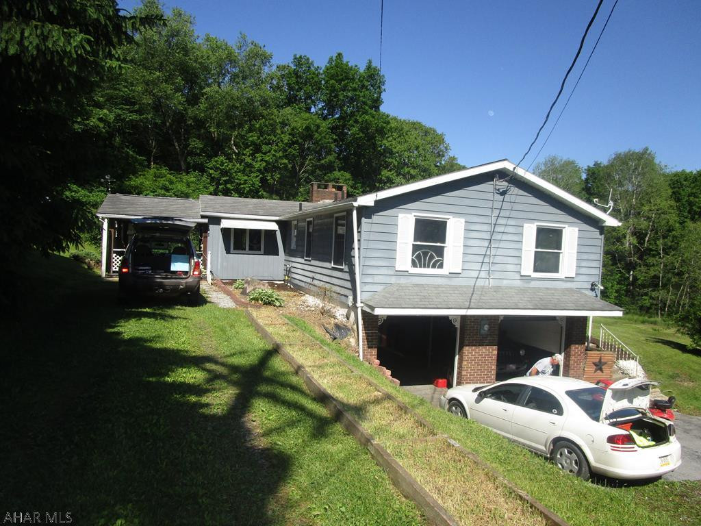 Modular split entry home being sold to settle estate.Nice home in private setting on dead end street with over 7 acres of partial lawn and woods. The home features 3 bedrooms and 1.5 baths. The living room has a woodburning fireplace. Eat in kitchen and family room. Coal stoker in addition to the oil heat (one flue). 2 car int garage and a one car detached garage and shed. Great location and home for the $$.