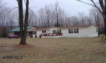 2000 Skyline sectional, 27x62, enclosed deck attached to garage. Generous sized bedrooms. Master bath with garden tub and shower. Owner occupied. Beautiful wooded lot with large lawn, nearly level. Directions: from Patton, go up St Lawrence Hill for about 2 miles, turn right on Cossiter Lane (directional sign) go about .5 mile to intersection and make a hard left, 200' sign on right.