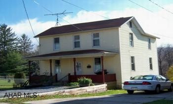 two story frame Great property. Newer windows, furnace and roof, 3-4 bedroom, kitchen, dining room, family room with rustic knotty pine walls, full width open front porch,, nice big back yard.