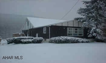 1.5 STORY SET ON 3 ACRES. HAS 4 BEDROOMS, EXTRA LARGE LIVING ROOM WITH STONE FIREPLACE & DETACHED ONE CAR GARAGE. STREAM AT REAR OF PROPERTY.  3 ACRE LEVEL LOT. STREAM AT REAR OF PROPERTY.  NEWER OIL FURNACE, KNOTTY PINE KITCHEN. HARDWOOD FLOORS. SELLER WANTS OFFERS. MOTIVATED.