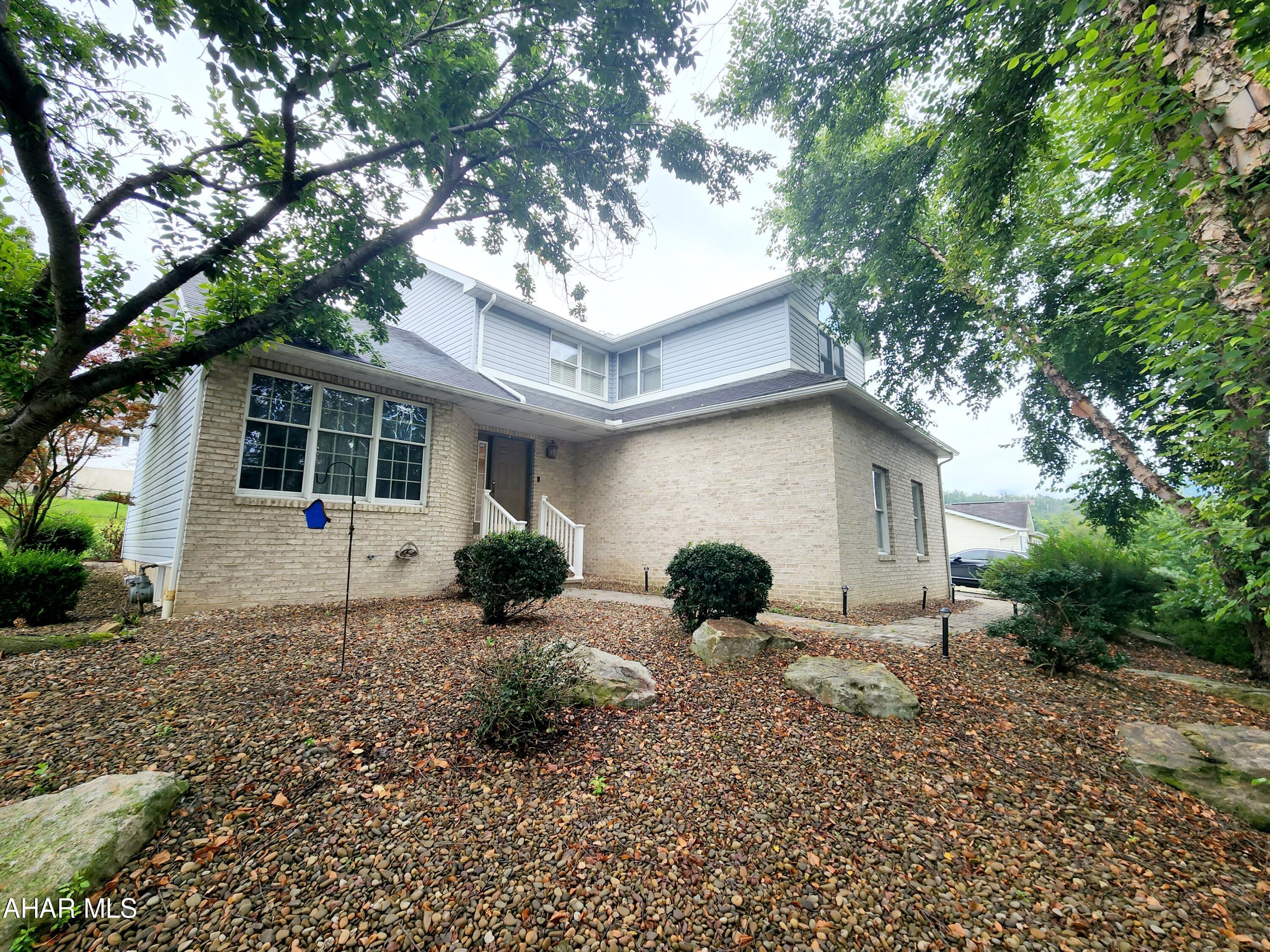 Three bedroom four bath home in Hollidaysburg School District.  This nice sized home, in Penn Farms, offers a large living room with vaulted ceilings, kitchen with breakfast bar, dining room/den with a beautiful gas fireplace, half bath, large pantry and garage entrance on the first floor. The second floor offers two bedrooms with large closets, a full bath, and large master suite with vaulted ceilings and private full bathroom. Enjoy a partially finished basement with laundry, bar area with seating and bonus room for lounging and entertaining. The backyard has a large ares for gardening, shed and relaxing back deck. Add your finishing touching to make this house your home. Call listing agent for more information or your tour.