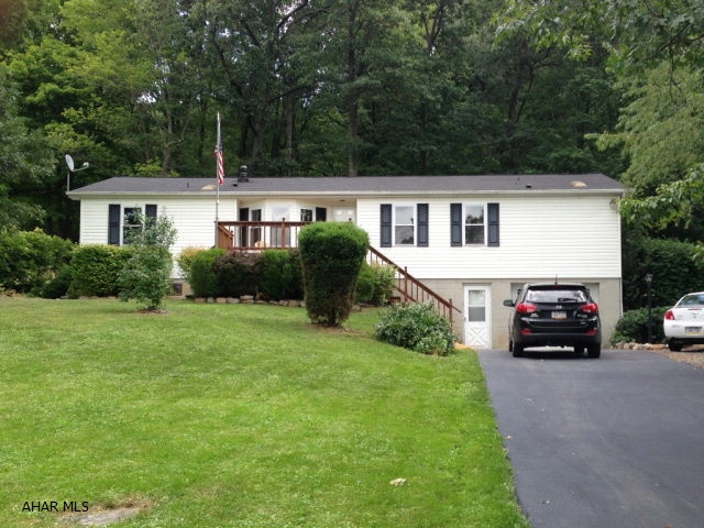 This 3 bedroom, 2 full bath home sports great curb appeal and the moment you walk in the home, the pride in ownership is obvious, as the home has been beautifully maintained. Shawnee Vinyl replacement windows are found throughout and a newly installed gas fireplace make for great energy efficiency. A main floor laundry room, huge country kitchen with loads of storage make this the ideal country home. The roof was replaced less than 4 years ago. The large sunroom is a great place to simply relax and enjoy nature. A lovely front deck takes in wonderful views of Wills Mountain. A storage shed and fire pit round out this great yard. State games lands are less than a mile down the road. Lake Gordon and Lake Koon provide amazing fishing opportunity.