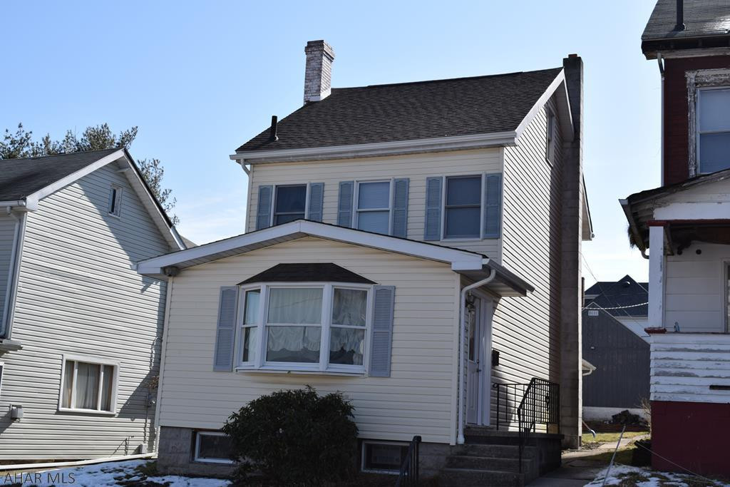 Nice three bedroomm two bath home with a detached garage and additional parking pad. Large living room and a spacious eat in kitchen with new flooring leading to a covered back porch.