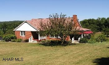 Immaculate and totally updated 1.5 Story Brick 4BR/2 1/2 BA with 1 car integral garage on large 1.63 acre lot. Side porch, rear deck, large garden, fruit trees, paved drive, new windows & doors. Large living room w/fireplace, loads of storage space