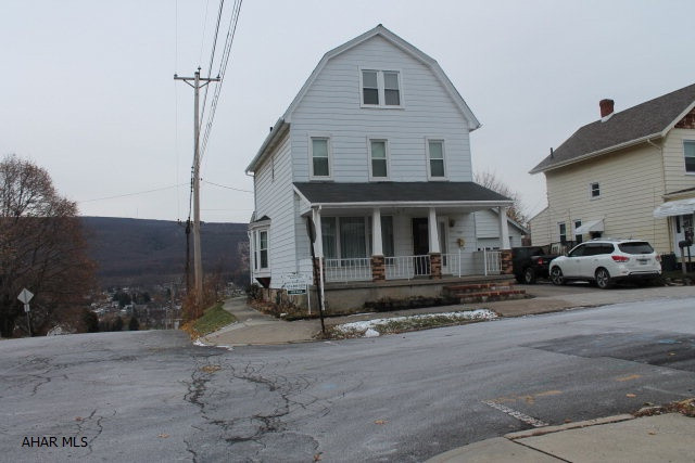 This SPACIOUS home sits on a double lot with a GORGEOUS view..  And a 2 car garage...Enjoy those hot days in the above ground pool with deck.. (new Liner) and fabulous view..Plenty of rooms with a lot of ideas Furnace is new..This is a must see ...HIGHLY MOTIVATED SELLER!!!!!