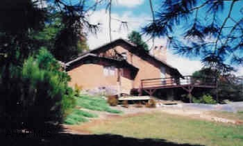 2 Story Contemporary with large detatched garage/shop and small barn.
