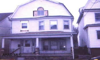 Large 4 bedroom home with finished and heated attic, could be 5th bedroom, new oak kitchen, new carpet, first floor laundry room.