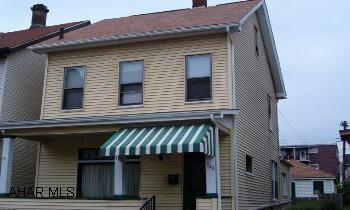 2 1/2 story vinyl sided with 1 car oversized detached garage, fenced yard and patio. Many updates. Charming 2 1/2 story vinyl sided home. 2-3 bedrooms, new carpet, dry wall & roof, updated electric, stained glass windows, craftsman style woodwork. All appliances included. Ready to move into! Agent related to seller.