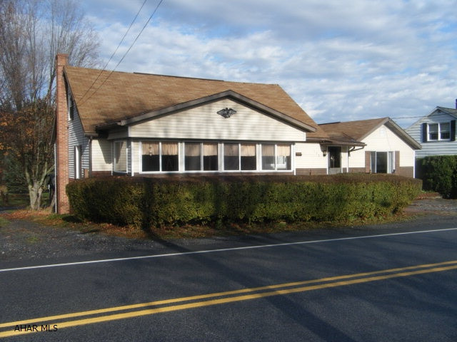 Main home is the larger, left side. The smaller right side is a separate kitchen, living room/bedroom and bathroom. Connected to the main home with an enclosed entryway. Nice sized rear yard with an old garage.