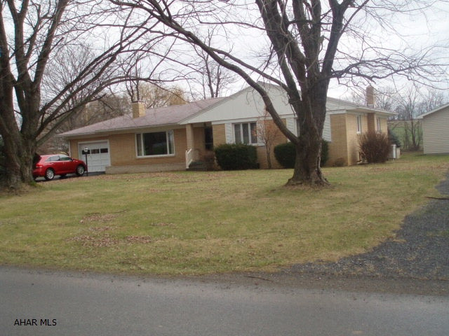 Very nice brick rancher on over 1.5 acres, 2 fireplaces oil heat with heat pump and central air.  1 car attached garage and 1.5 car heated detached garage.  Quiet stream running through property.