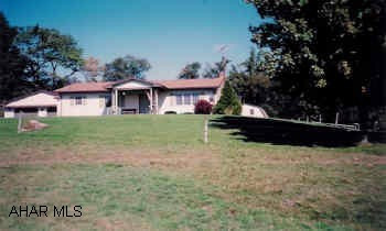 Ranchette with view. Horse lover's dream. Bank barn w/stalls, tack room, complete fencing. Nice 4 Bedroom Rancher w/finished basement and oversized garage with large workshop.