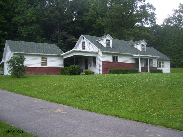 Well-maintained, spacious, 2-story home on 1.42 acres conveniently located.  3BD, 1BA, with mature landscaping. Features include oversized detached garage, attached 2-car garage, car port or pavilion, main level laundry, and plenty of storage.  Move-in ready.