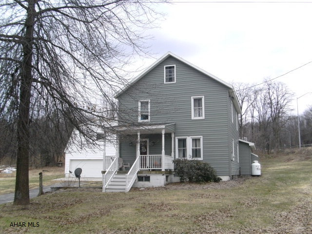 A Must See! Totally remodeled two story home, large lot, detached 3 car garage with 2nd floor storage. Above ground pool, heater and all equipment included. 3 bedrooms, 2 large baths, 1st floor laundry, new stainless appliances, family room with fireplace, large eat in kitchen, formal dining room. This home has so much to offer! 2 additional lots also included.