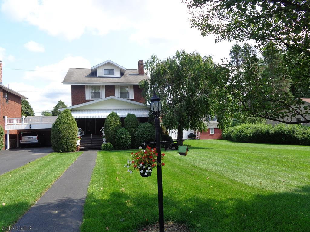 MOTIVATED SELLER!  This Aldrich Ave home is a symbol of luxury.  Outstanding outside & inside.  Stunning 1st floor Family Room & Full Bathroom.  A welcoming front porch invites relaxation & delivers jaw-dropping curb appeal.  Quartz kitchen countertop, 2 car garage, plus 2 car carport.  Hardwood floors under carpet.  Finished attic is the 3rd bedroom.  One of the bedrooms is currently used as a walk in closet.