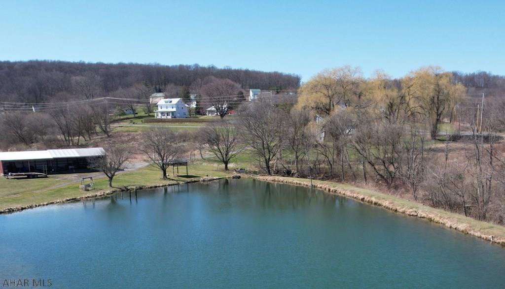 Bedford County is home to incredible farms and this is no exception. 155 +/- acres (73 tillable, 47 wooded, 26 pasture, 2 building acres) of mostly flat farmable land and great hunting ground.  Enjoy the peaceful views of the large pond surrounded by wonderful vistas from the spacious renovated farm house complete with master suite with walk in closet and private bath.  A 2 bedroom apartment (960 sq ft) is found above the workshop. The barn is in very good condition as are the outbuildings & 5 car garage.  Farm consists of 2 story bank barn 88'x80', Milk House 10'x17', Frame Garage 24'x24', Pole Building 16'x44', Pole Building 20'x30', Machine Shed 18'x50', Machine Shed 11'x12'.  Located within easy access to the Pennsylvania Turnpike, Interstate 99 and Lincoln Highway.