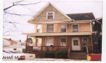 First floor - kitchen, living room, bath with shower, 3 bedrooms.  Second floor - kitchen, living room, 2 bedrooms, bath with shower.  Second floor apartment has use of attic.  Laundry hookup in basement. JUNIATE DUPLEX, 2 story brick home off Park Blvd.  Desirable location.  Close to college - great for student housing. Turn right off Park Blvd. onto 11th Avenue, house is on left.