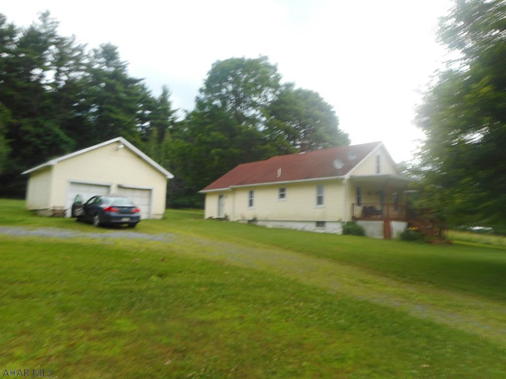 Country living!  1.5 Story vinyl sided home on 1.5 acres. Remodeled kitchen and bath. Newer dining room addition with cathedral ceiling. 1st floor bedroom and den/office. Spring on neighbors property provided the water and their is a conditioner, softner and UV lite. Roof installed in 2005.