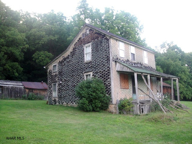 7.983 acres on Plank Road, Everett. Two-story colonial home w/ 4 BR's. House not currently livable. Well and septic on property. 9x26 frame shet and 19x36 flat barn. Nice property in a serene location!