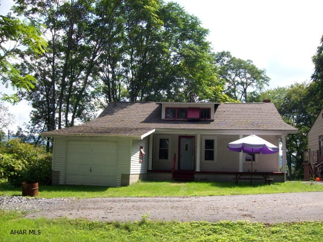 Cute Cape Cod on dead end street in wooded setting.  Second floor has additional 3 rooms which could be bedrooms, home needs TLC-newer roof (needs kitchen cabinets) but has tons of potential.