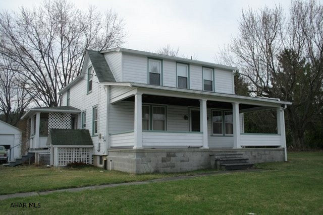 1 -1/2 story home located on a level lot in the quiet town of Alum Bank. Original hardwood floors throughout the entire home and a newly remodeled bathroom upstairs. Large windows provide lots of natural lighting. Partially finished, walkout basement with a bathroom and shower. A large truck garage and a two-car garage also on the property. Property sold AS-IS.